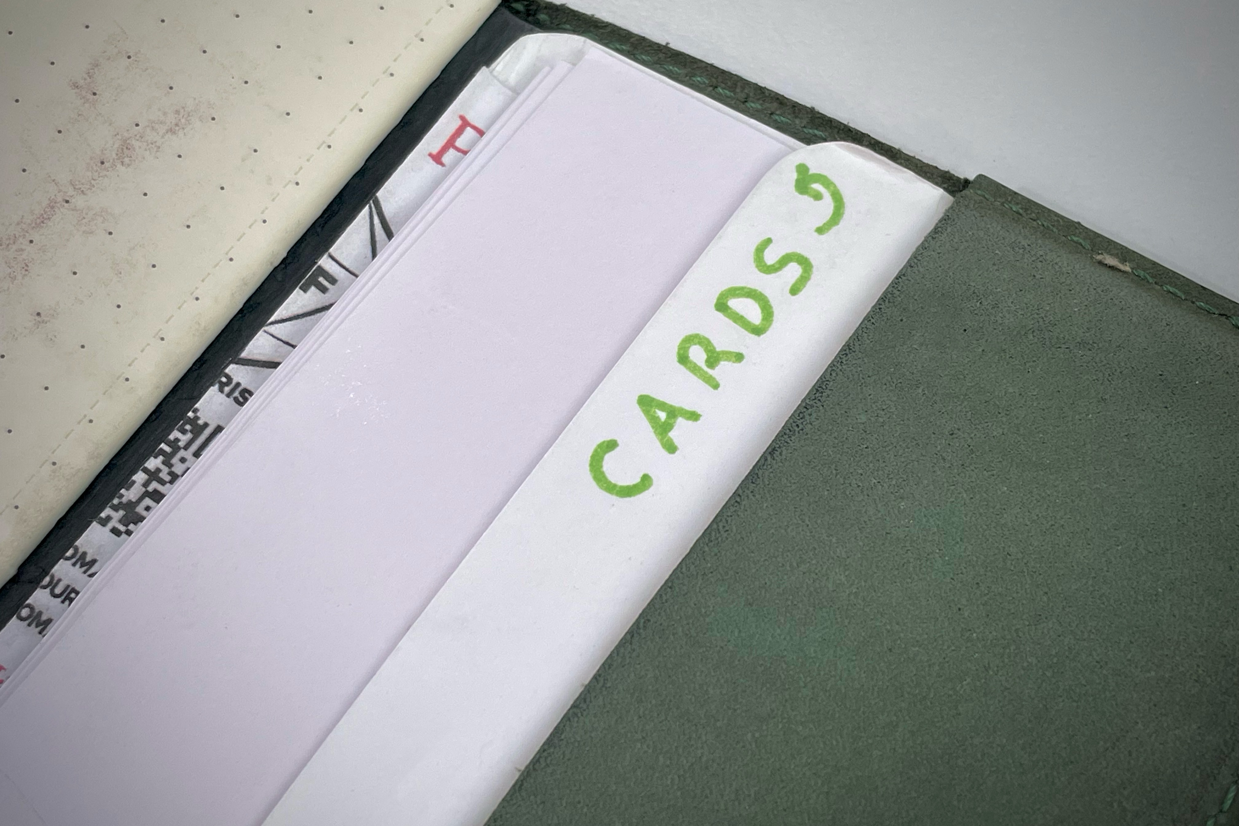 Index cards tucked into the back of the notebook cover with a label stating “cards” with an arrow, you know, just in case I forget